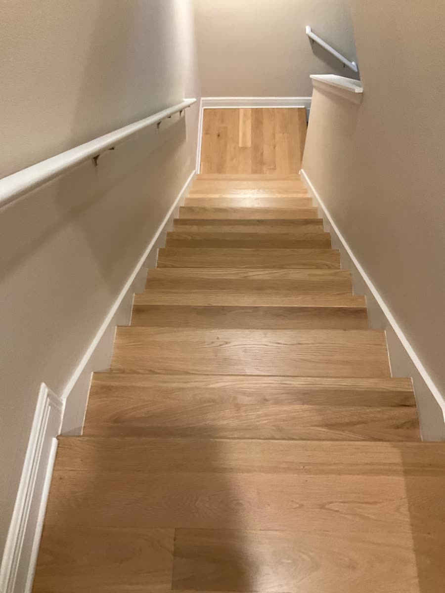 refinished oak hardwood stair treads in stairwell